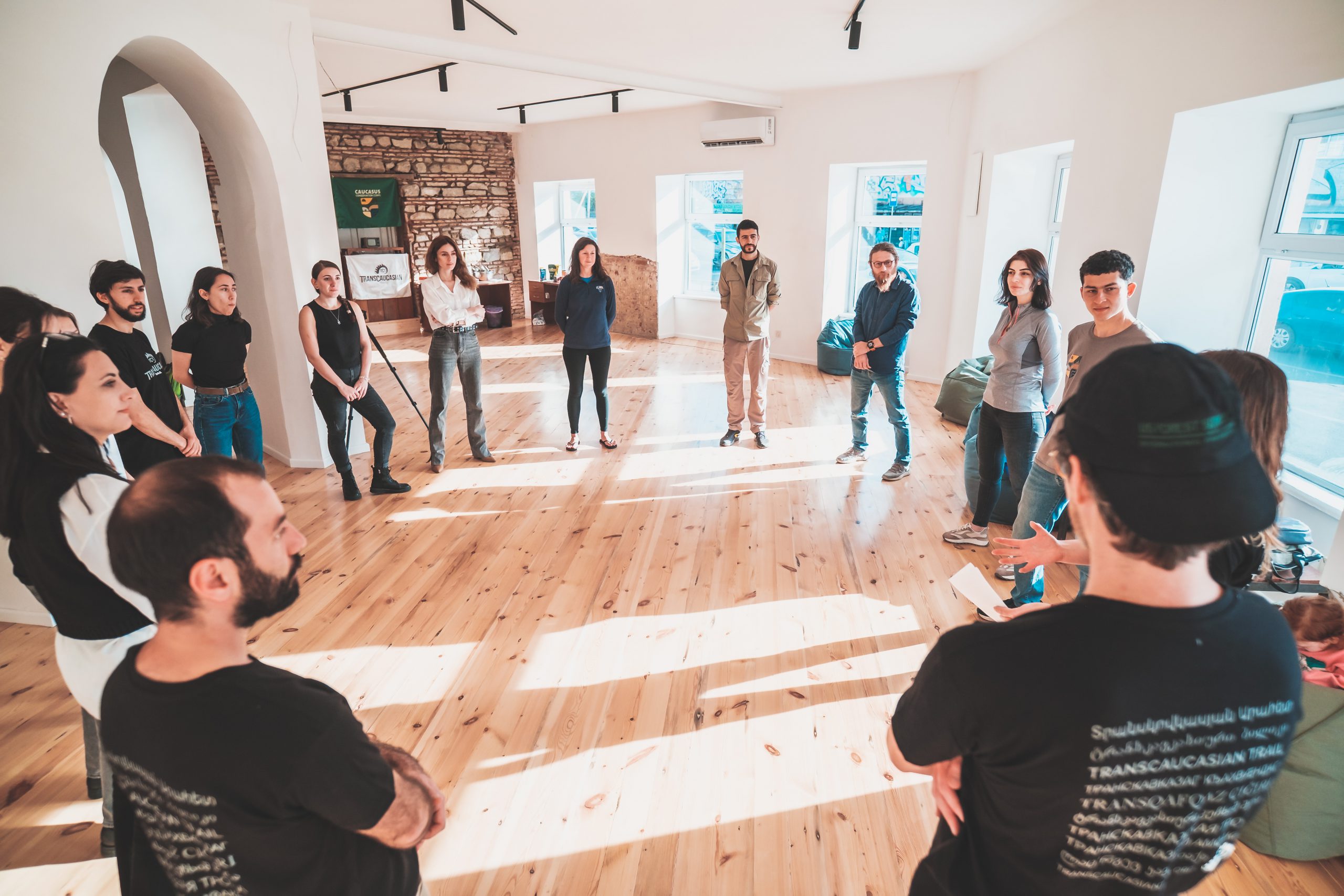 Safety Circle is a TCT tradition - even when we're inside discussing strategy instead of outside swinging Pulaskis. Photo by Duncan Maccallum.