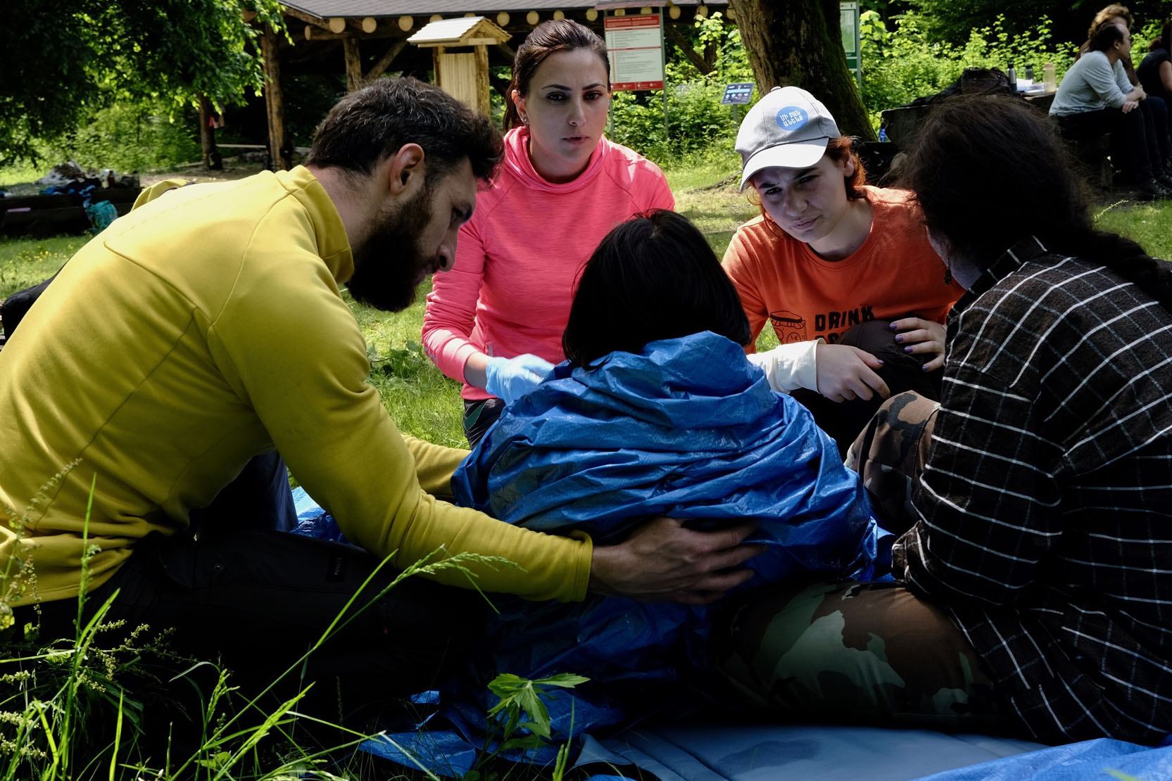 Wilderness First Responder candidates assess and treat their "patient" during one of many practical scenarios.
