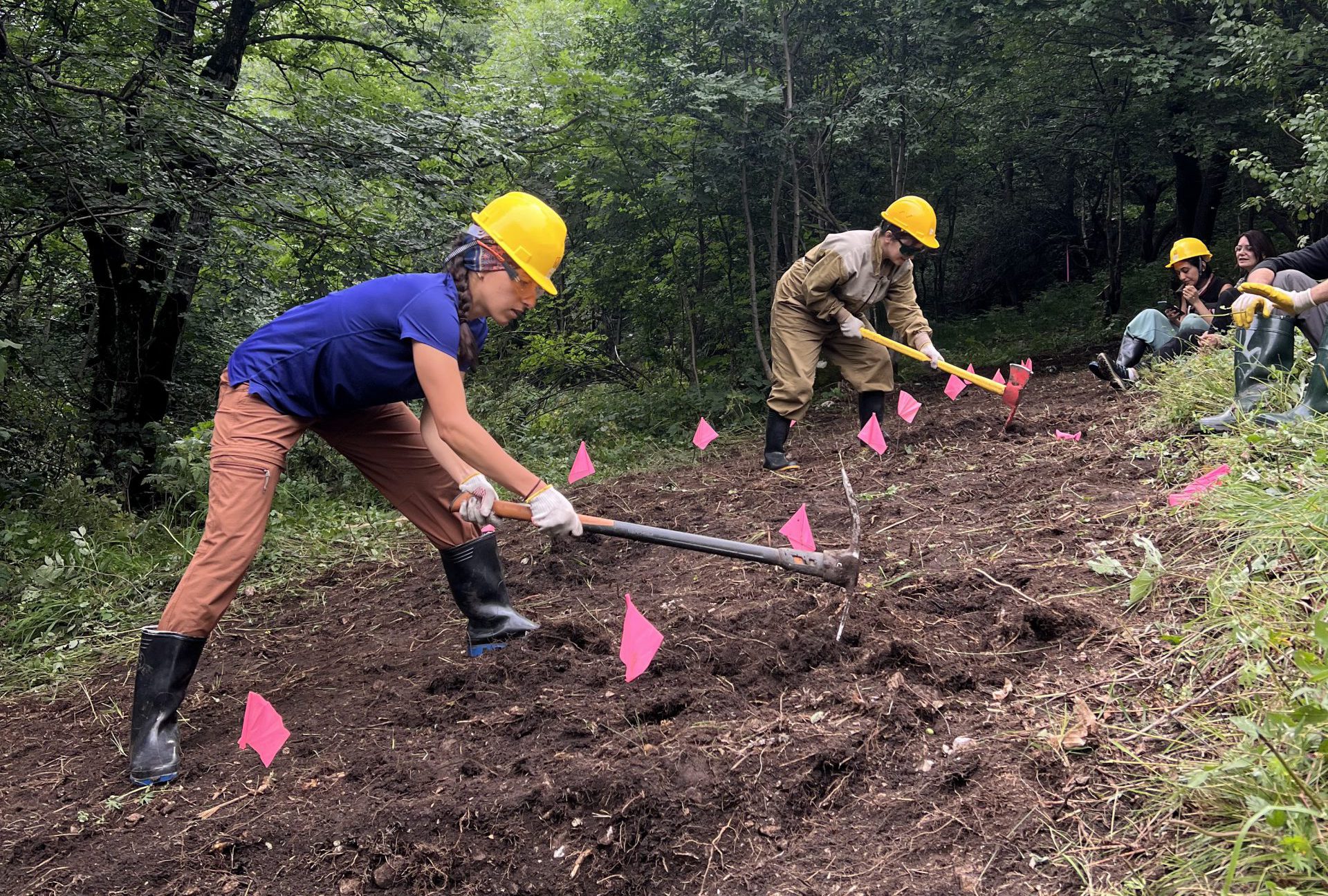 Aspiring crew leaders and trainers construct part of a new trail on the Guba-Gusar section of the TCT in Azerbaijan. 
Trainees strike a pose with their tools.
