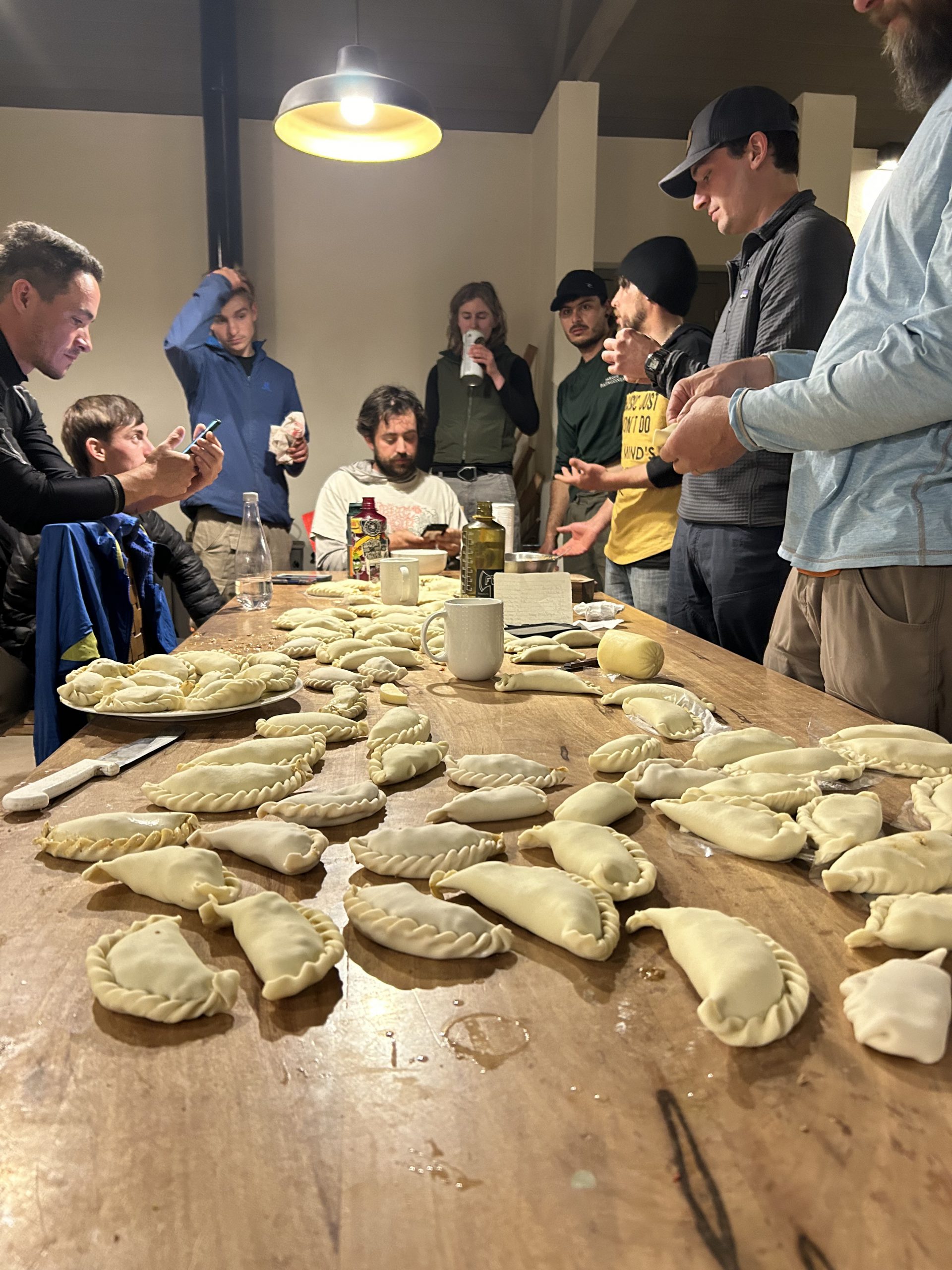 Volunteers make empanadas