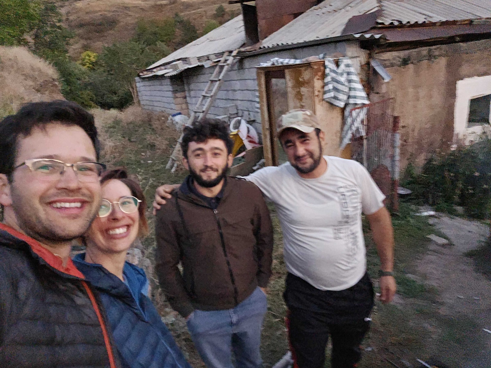 Hikers Jeff and Ellie with trail builders Tigran and Garnik.